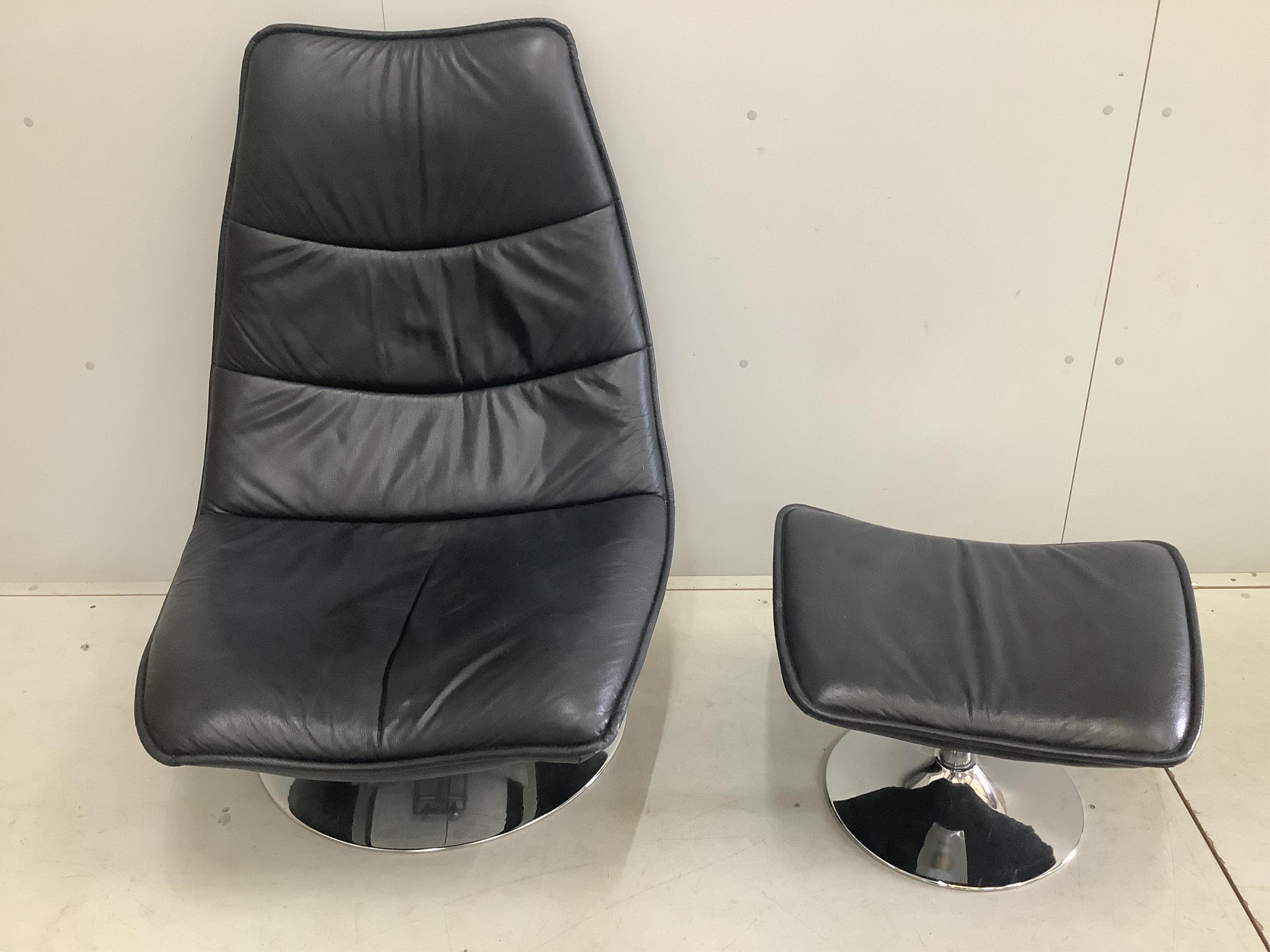 An Italian leather and chrome tilt and swivel chair, width 78cm, depth 74cm, height 104cm and a footstool